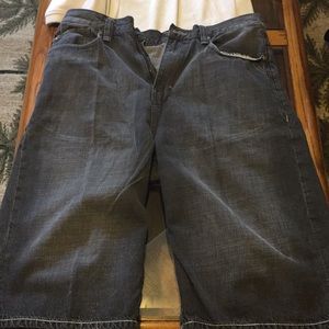 Ecko grayish jean shorts and red shirt